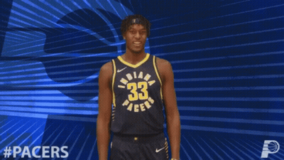 A Basketball Player For The Indiana Pacers Celebrates With His Arms Outstretched GIF