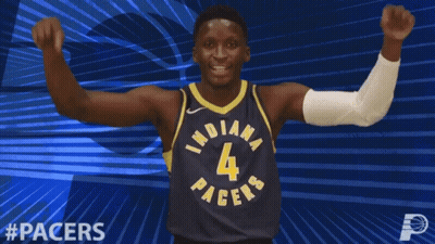 A Basketball Player For The Indiana Pacers Celebrates With His Fist In The Air GIF