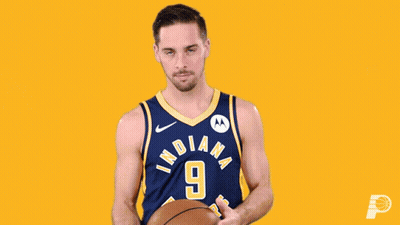 A Basketball Player For The Indiana Pacers Holds A Basketball GIF