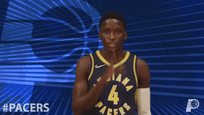 A Basketball Player For The Indiana Pacers Holds His Hand To His Mouth GIF