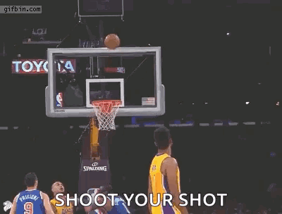 A Basketball Player For The Lakers Is Jumping In The Air With His Arms Outstretched GIF