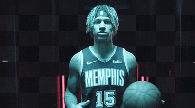 A Basketball Player For The Memphis Grizzlies Holds A Basketball GIF