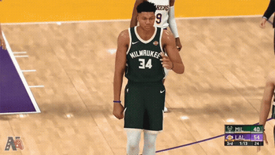 A Basketball Player For The Milwaukee Bucks Is Walking On The Court GIF