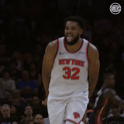 A Basketball Player For The New York Knicks Is Standing On The Court GIF