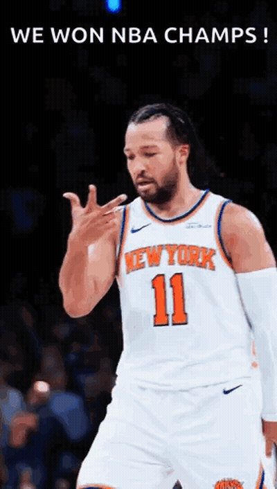 A Basketball Player For The New York Knicks Is Standing On The Court . GIF