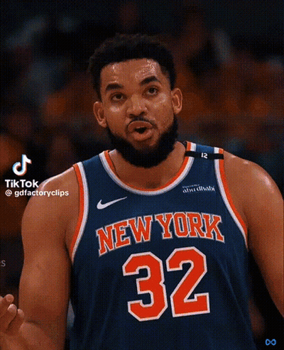 A Basketball Player For The New York Knicks Is Wearing A Blue Jersey With The Number 32 On It GIF