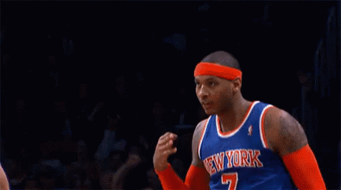 A Basketball Player For The New York Knicks Salutes During A Game GIF