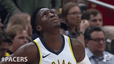 A Basketball Player For The Pacers Looks Up In The Air GIF