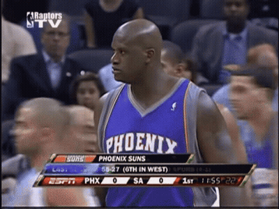 a basketball player for the phoenix suns is standing in front of a crowd