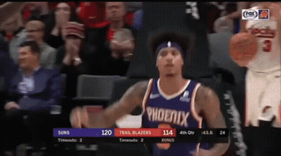 A Basketball Player For The Phoenix Trail Blazers Is Dribbling A Basketball GIF