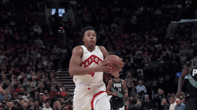 A Basketball Player For The Raptors Is Dribbling A Basketball GIF