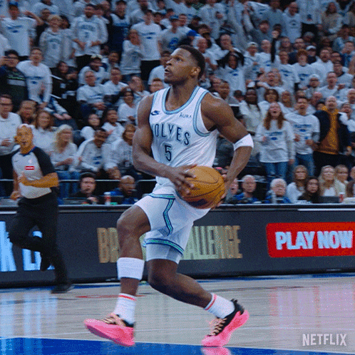 A Basketball Player For The Wolves Is Dribbling A Basketball GIF