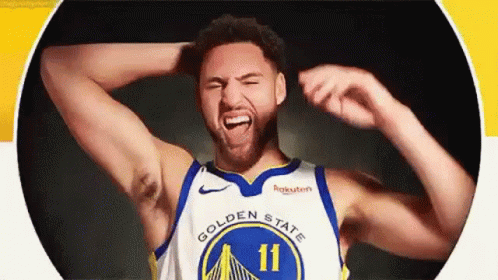 A Basketball Player From The Golden State Warriors Is Making A Funny Face With His Hands In His Hair . GIF