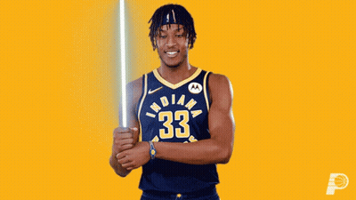 A Basketball Player From The Indiana Pacers Holds A Light Saber GIF