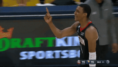 A Basketball Player Giving A Middle Finger In Front Of A Scoreboard GIF