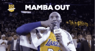 A Basketball Player Holding A Microphone With The Words " Mamba Out " Behind Him GIF