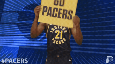 A Basketball Player Holds A Sign That Says Go Pacers GIF