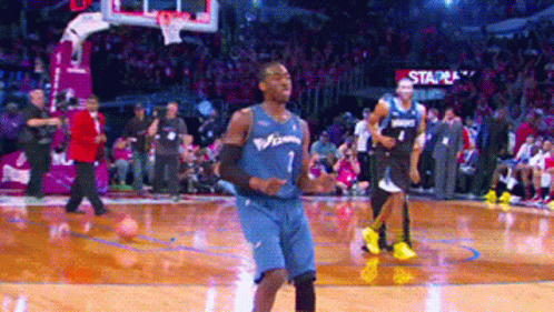 A Basketball Player In A Blue Jersey With The Number 7 On It GIF