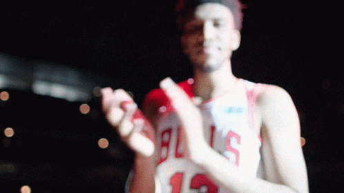 A Basketball Player In A Bulls Jersey Clapping His Hands GIF