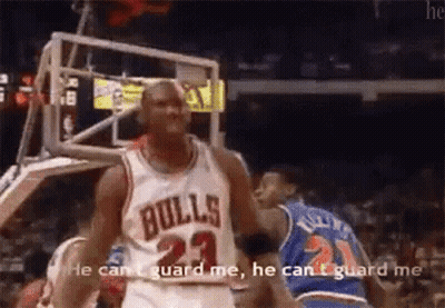 A Basketball Player In A Bulls Jersey Is Talking To Another Player . GIF