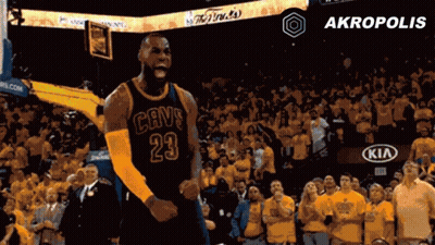 A Basketball Player In A Cavs Jersey Celebrates In Front Of A Crowd GIF