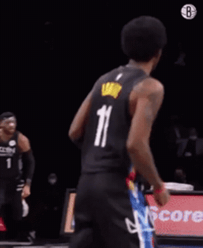 A Basketball Player In A Cavs Jersey Is Dancing On The Court GIF