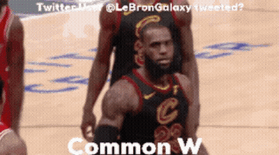 A Basketball Player In A Cleveland Cavaliers Uniform Stands On The Court GIF