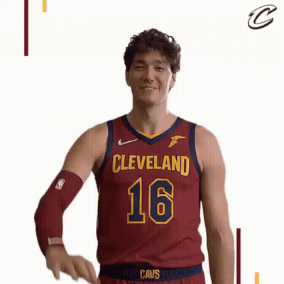 A Basketball Player In A Cleveland Cavs Jersey Is Waving His Hand . GIF