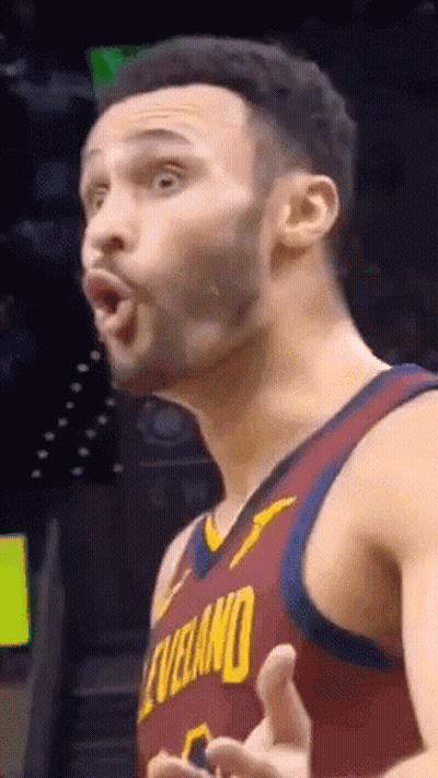 A Basketball Player In A Cleveland Jersey Is Making A Funny Face . GIF