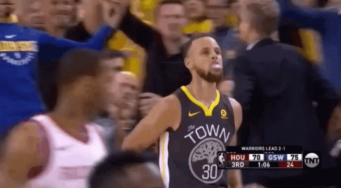 A Basketball Player In A Golden State Warriors Jersey Stands In Front Of A Crowd . GIF