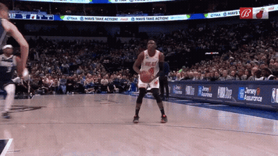 A Basketball Player In A Heat Jersey Stands On The Court GIF