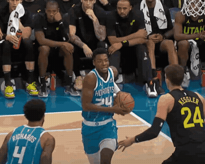 A Basketball Player In A Hornets Jersey Dribbles The Ball GIF