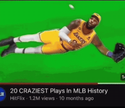 A Basketball Player In A Lakers Uniform Is Catching A Ball On A Green Screen . GIF