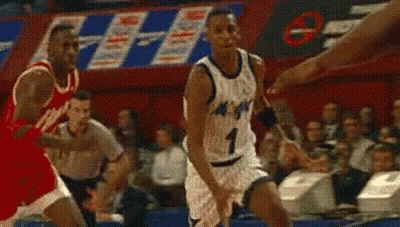 A Basketball Player In A Magic Jersey Is Dribbling A Ball GIF