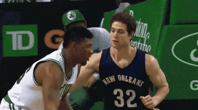 A Basketball Player In A New Orleans Jersey Is Talking To Another Player GIF