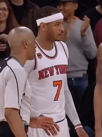 A Basketball Player In A New York Jersey Is Talking To A Referee GIF