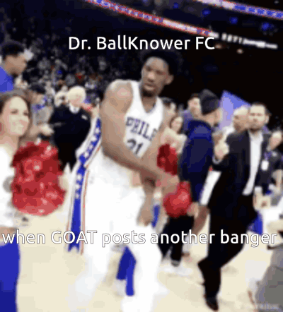 A Basketball Player In A Philadelphia Uniform Is Dancing With Cheerleaders GIF