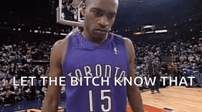 A Basketball Player In A Purple Jersey With The Number 15 On It Is Standing In Front Of A Crowd . GIF