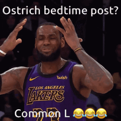 A Basketball Player In A Purple Lakers Jersey Is Making A Funny Face GIF