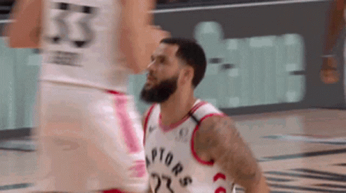 A Basketball Player In A Raptors Jersey Is Getting Ready To Shoot A Shot . GIF