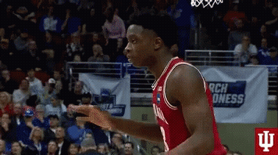 A Basketball Player In A Red Jersey Is Jumping In The Air GIF