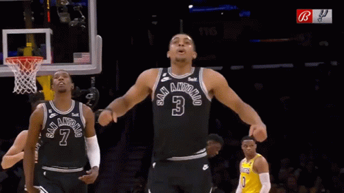 A Basketball Player In A San Antonio Jersey Stands In Front Of A Basketball Net GIF