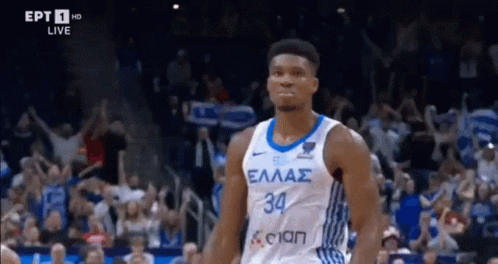 A Basketball Player In A White And Blue Jersey With The Number 34 On It GIF