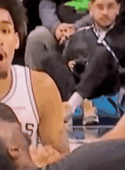 A Basketball Player In A White Jersey With The Number 5 On It Is Talking To Another Player . GIF