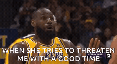 A Basketball Player In A Yellow Jersey Is Talking To Another Player During A Game . GIF