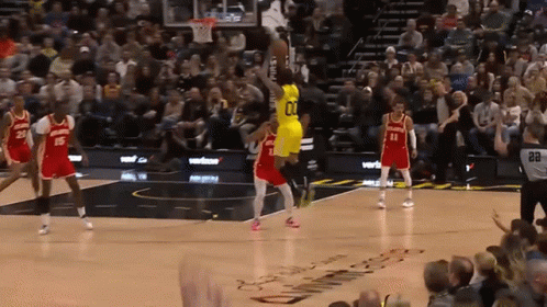 A Basketball Player In A Yellow Jersey With The Number 01 On It GIF