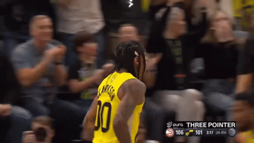 A Basketball Player In A Yellow Jersey With The Number 10 On It GIF