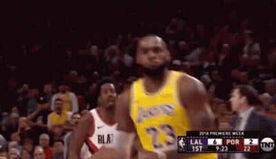 A Basketball Player In A Yellow Jersey With The Number 23 GIF