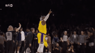 A Basketball Player In A Yellow Jersey With The Number 6 On It Is Dancing On The Court . GIF