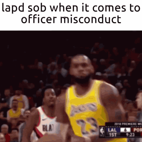A Basketball Player In A Yellow Lakers Jersey Is Running Towards A Police Officer GIF